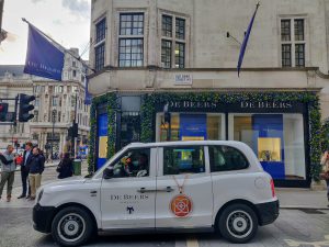 Sherbet Media De Beers electric taxi London Old Bond Street with a full taxi wrap